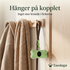 Bajspåshållare som hänger på kopplet